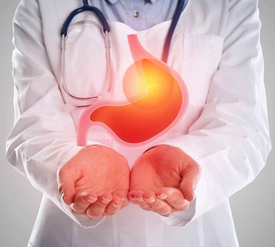 Experienced interventional radiologist in Abbottabad discussing gastroenterology treatment options with a patient