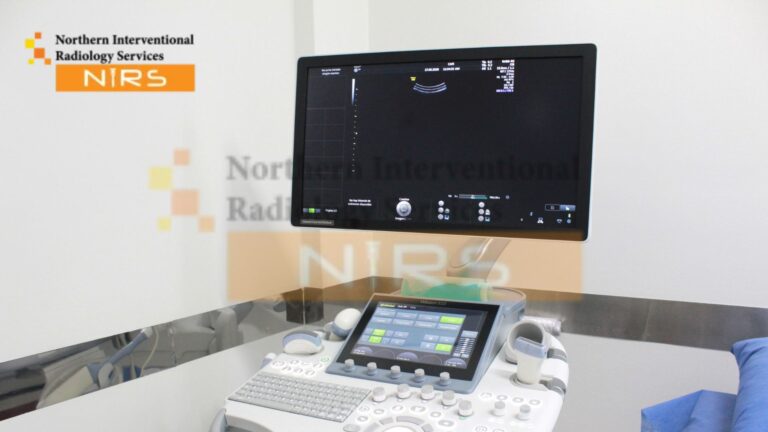 Expert radiologist performing ultrasound-guided transhepatic lymph node biopsy in Islamabad with advanced image-guided techniques