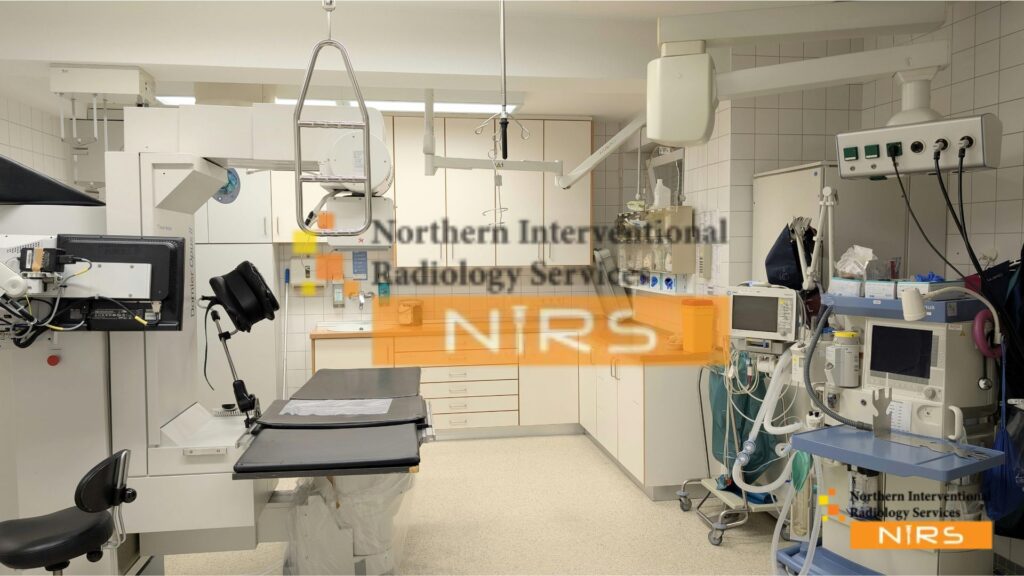 Interventional radiologist performing minimally invasive procedure using imaging guidance, reducing patient surgery and recovery time.