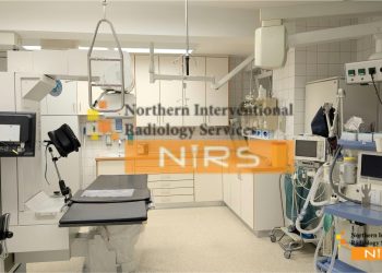 Interventional radiologist performing minimally invasive procedure using imaging guidance, reducing patient surgery and recovery time.